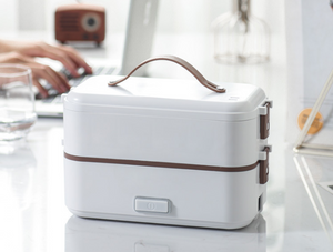 The electric lunch box  plugged into the electric heating, heat preservation, cooking and hot rice artifact