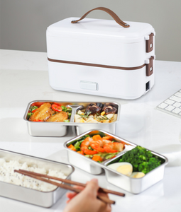 The electric lunch box  plugged into the electric heating, heat preservation, cooking and hot rice artifact