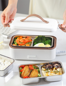 The electric lunch box  plugged into the electric heating, heat preservation, cooking and hot rice artifact